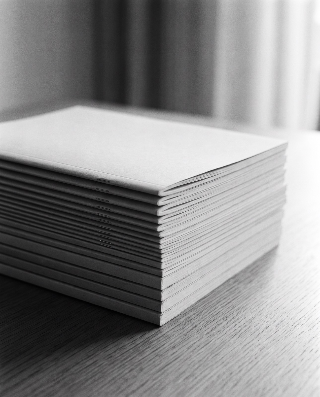 A stack of plain unmarked manuals